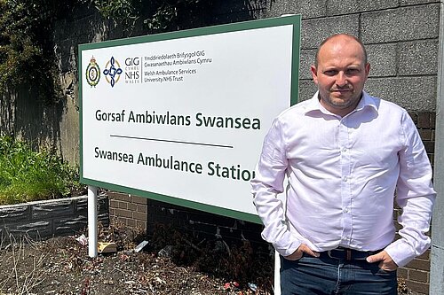 Cllr Sam Bennett outside Swansea Ambulance Station